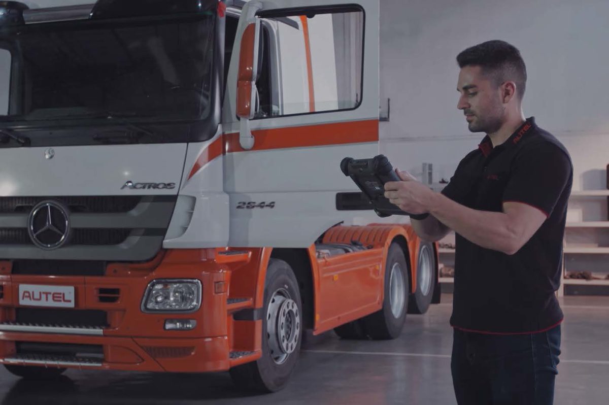 Autel-employee-working-on-calibration-on-semi-truck-1200×798 Autel employee working on semi truck
