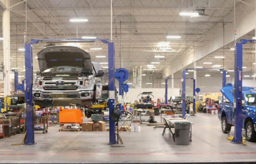 Body-shop-working-on-car-1200×766 body shop with cars on lifts