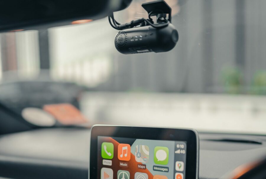Car-with-camera-view-in-windshield-1200×809 camera mounted to window on car