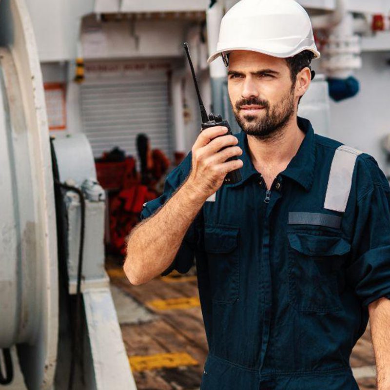 construction worker talking on walkie talkie