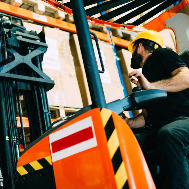forklift driver picking up package forklift moving shipping container