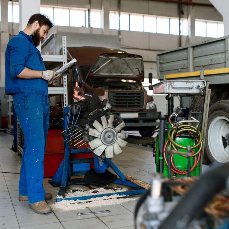 technician diagnosing engine