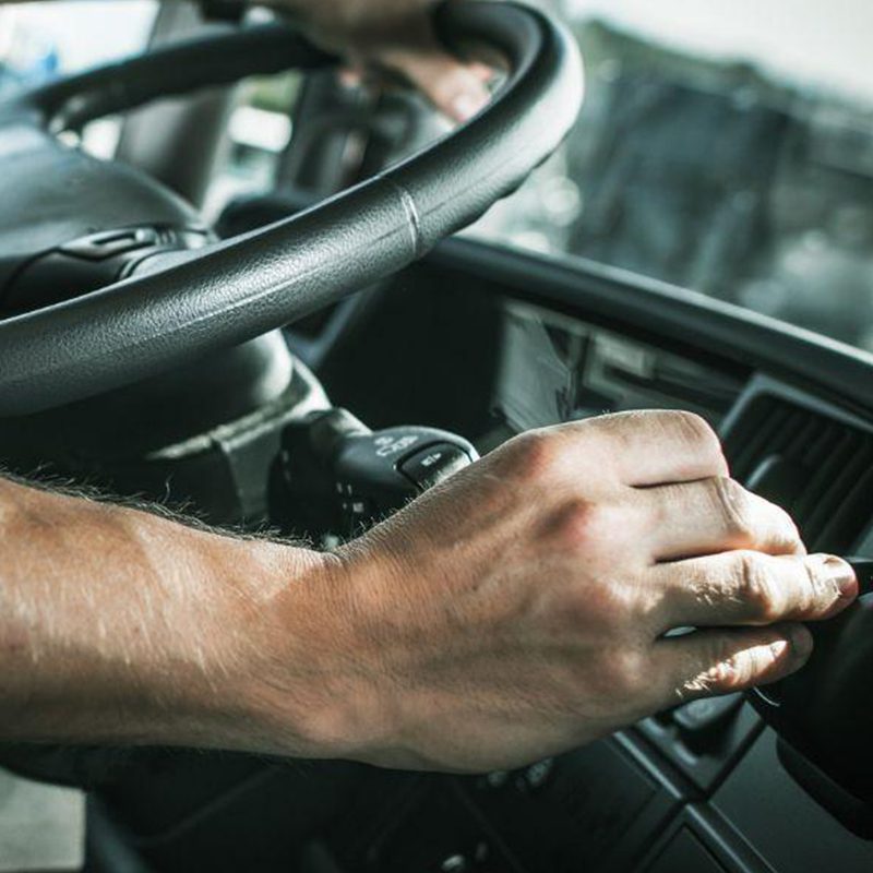 driver adjusting air vents